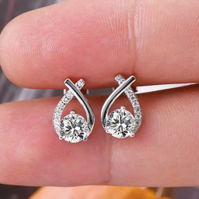 Elegant Fishtail Cross diamond earrings featuring teardrop settings for trendy wear