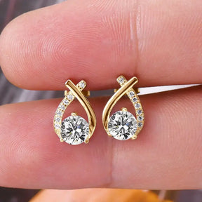 Gold teardrop diamond earrings featuring a fishtail cross design for trendy wear