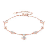 Delicate rose gold anklet adorned with crystal flowers, complementing the Four-Leaf Clover Bracelet