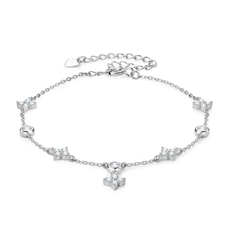 Delicate silver anklet with crystal butterfly charms and a Four-Leaf Clover Bracelet design