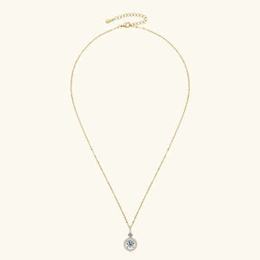 Gold-toned lab grown diamond pendant necklace with circular blue gemstone accent