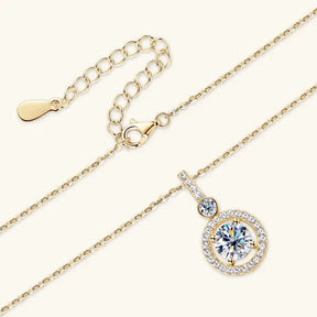 Delicate gold necklace featuring a round lab grown diamond pendant with crystal accents