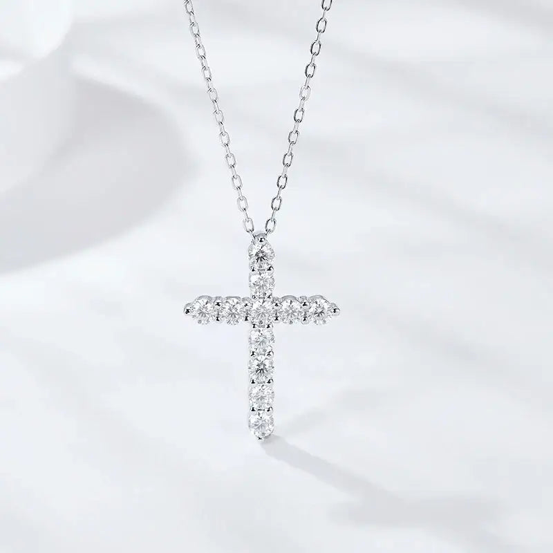 Diamond-studded cross pendant on a sterling silver chain in the Moissanite Cross Necklace