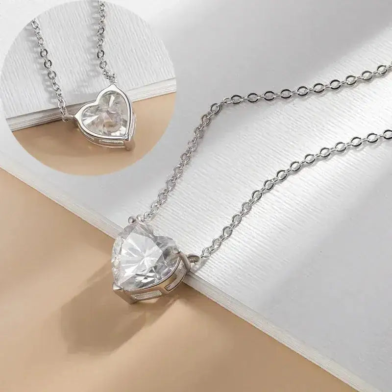 Heart-shaped pendant necklace with clear gemstone on sterling silver chain in Moissanite Jewelry