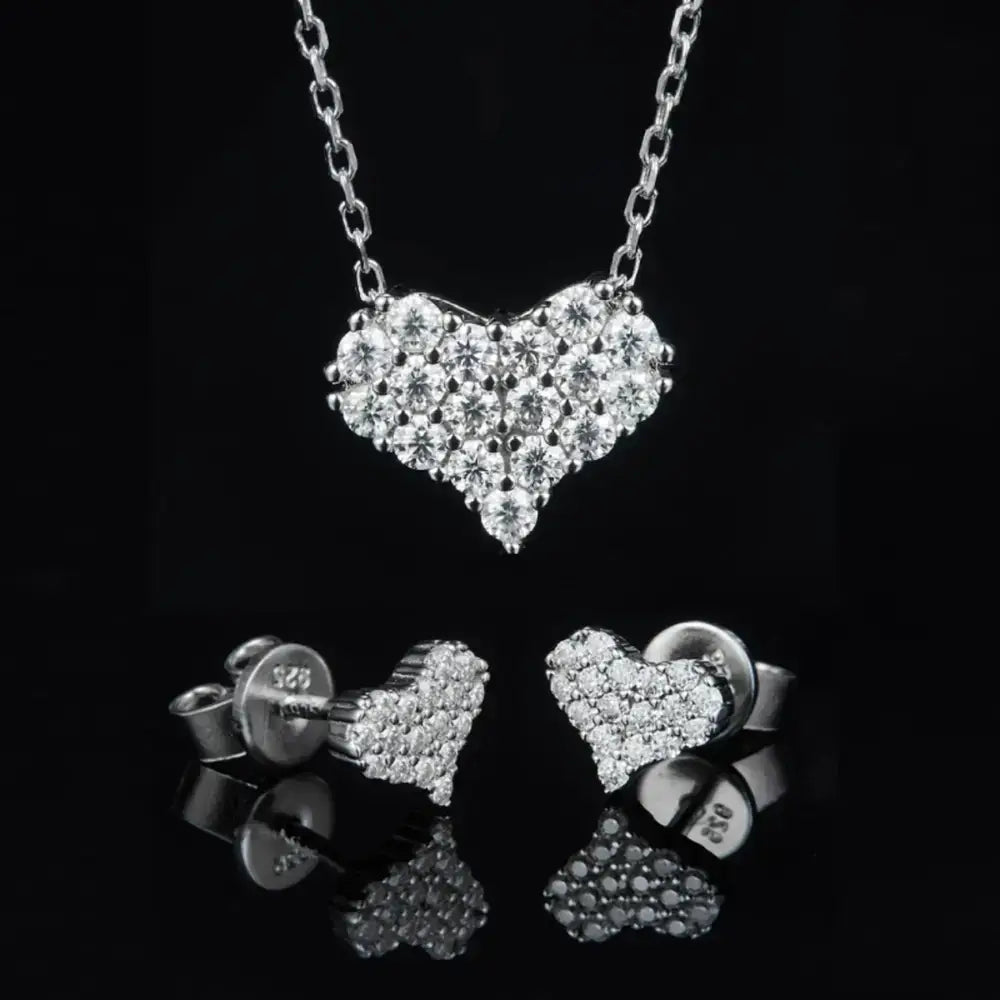 Heart-shaped diamond pendant necklace and stud earrings in elegant Moissanite Diamonds set