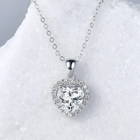 Heart shaped lab grown diamond pendant necklace on a 925 silver chain with halo diamonds