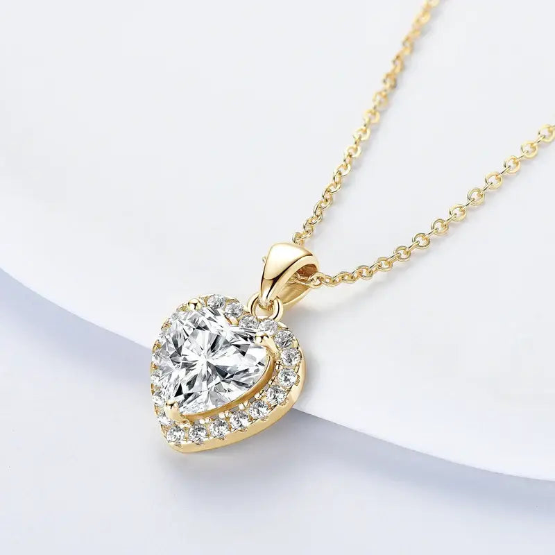 Heart-shaped lab grown diamond pendant on a gold chain necklace in 925 Silver