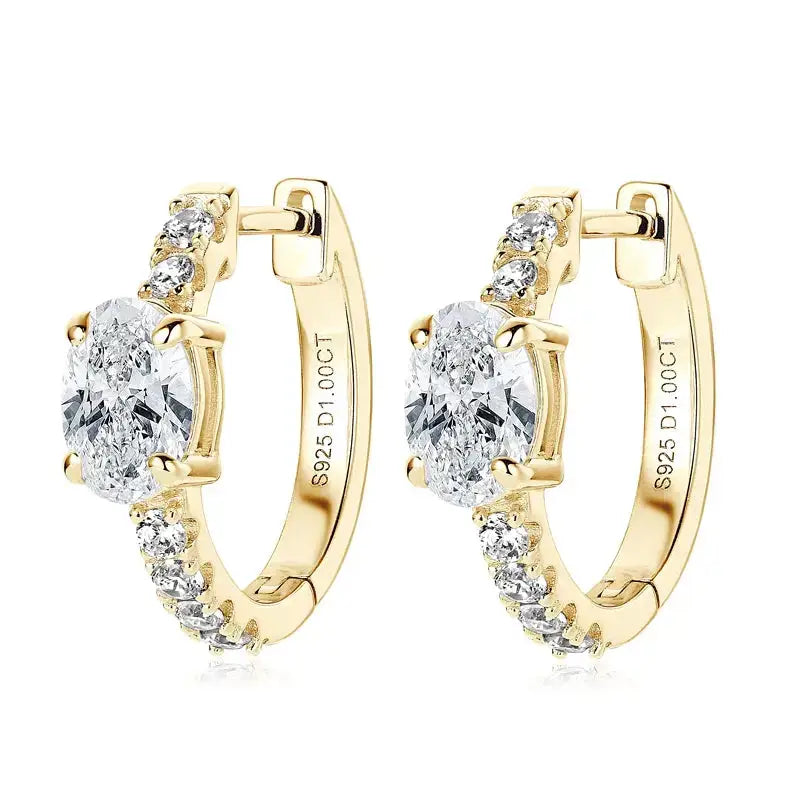 Gold hoop huggie earrings with oval cut moissanite and accent diamonds in sterling silver