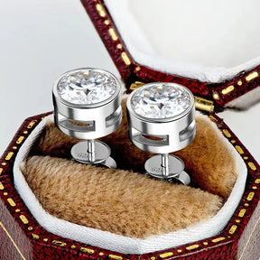 Pair of sterling silver cufflinks with round crystal tops in a gold plated moissanite box