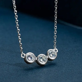 Silver necklace featuring three round diamond pendants in 18k white gold plated moissanite