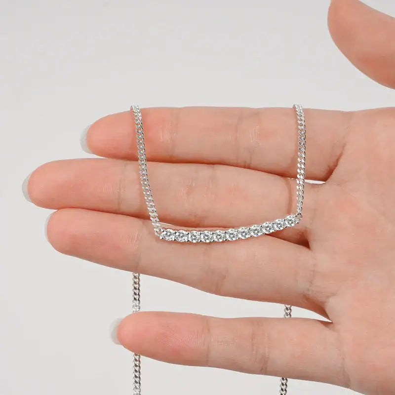 Curved Lab Grown Diamond Choker Necklace in Sterling Silver 925 held in an open palm