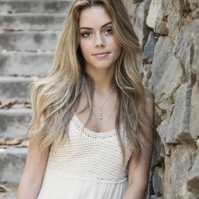 Young woman in crochet top showcasing Lab Grown Diamond Long Pendant Necklace in Sterling Silver