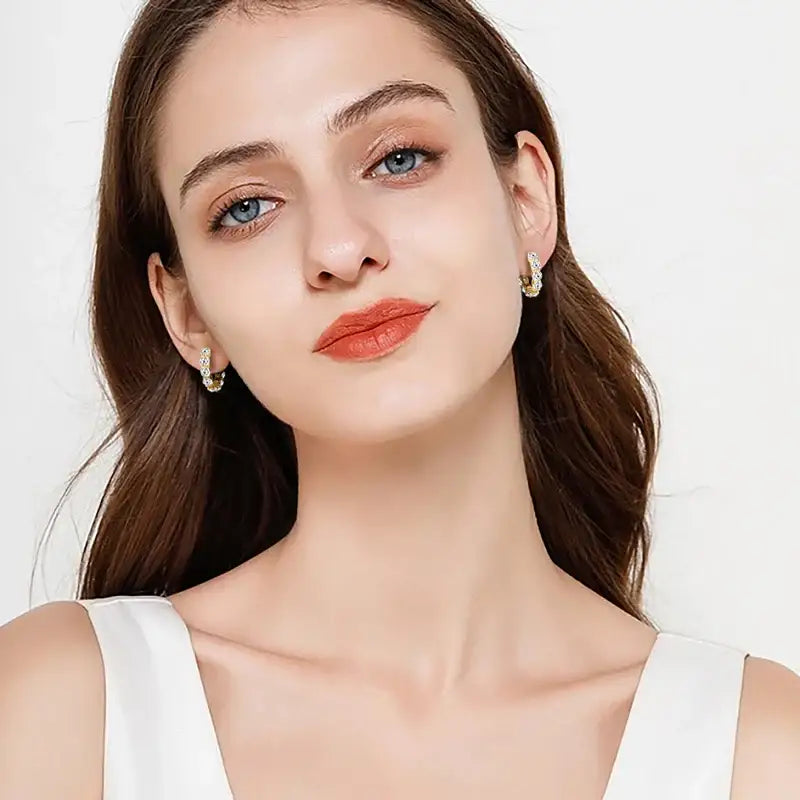 Young woman with long brown hair showcases Luxury Hoops Lab Grown Diamond Earrings