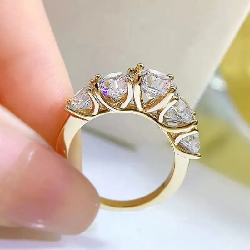 Gold ring with five heart-shaped diamonds in graduated arrangement, Moissanite wedding ring