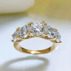 Gold Moissanite 5 Stone Wedding Band featuring five diamonds in graduated arrangement