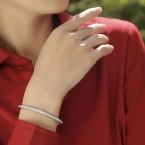 Silver bracelet worn on wrist showcasing Moissanite Bangles and 925 Sterling Silver jewelry