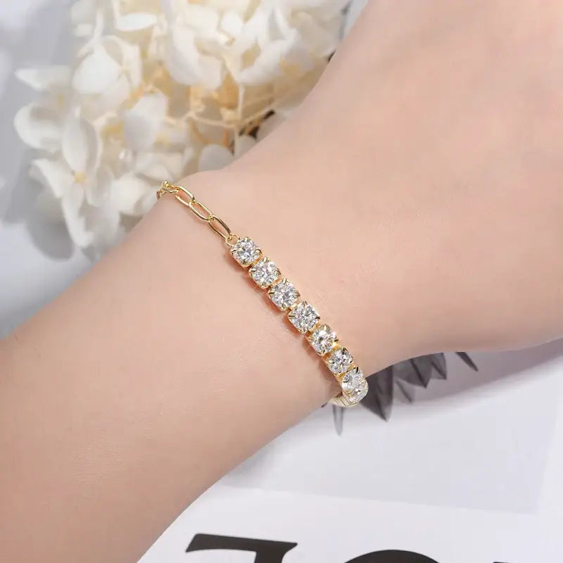 Gold bracelet with sparkling stones, featuring the Moissanite Diamond Bracelet - Elegance