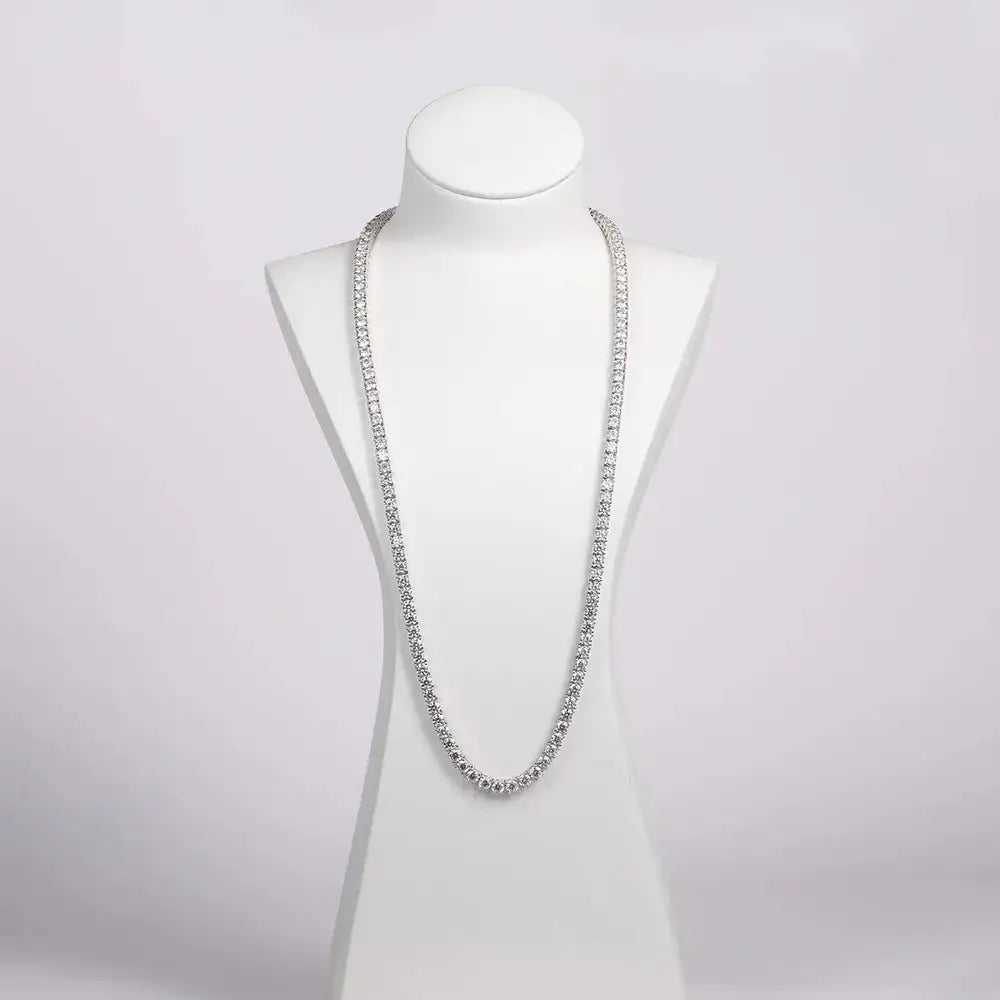 Silver beaded necklace on a white bust showcasing Elegant 18K Gold Moissanite Diamond Tennis