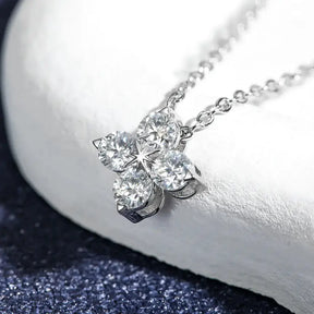 Moissanite Four-leaf Flower Pendant Necklace in Sterling Silver with diamond accents