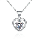 Heart-shaped silver pendant necklace featuring a diamond, part of Telles Jewelry’s Moissanite Heart Necklace