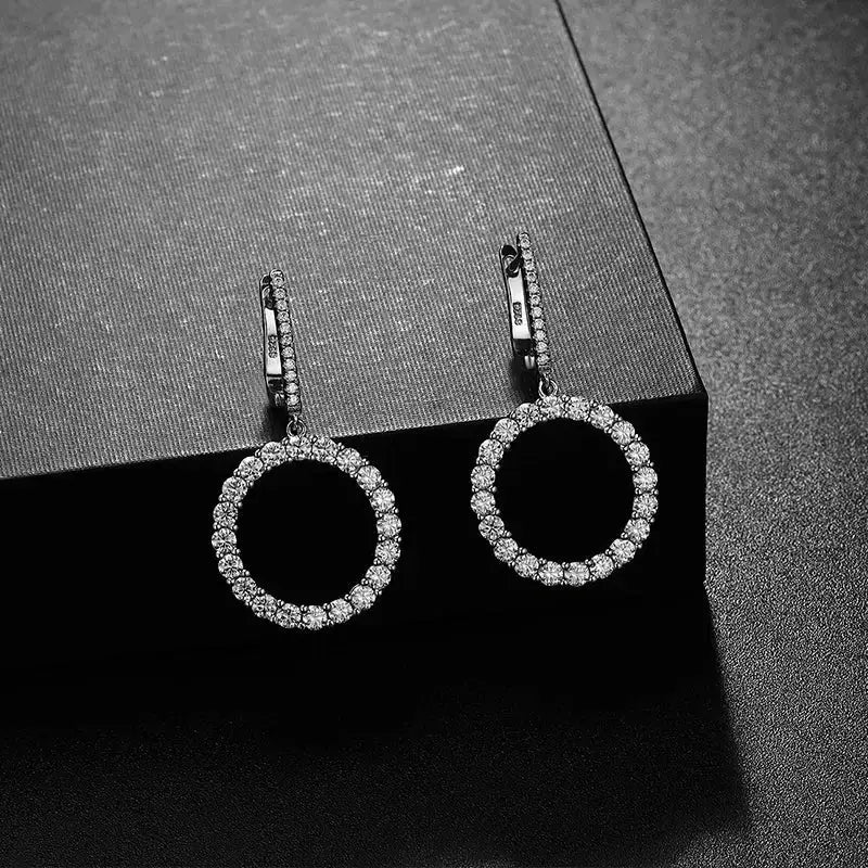 Pair of circular diamond hoop earrings in 18k white gold, showcasing Sparkling Elegance