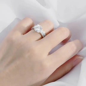 Diamond engagement ring featuring a center stone on a sterling silver band from Telles Jewelry