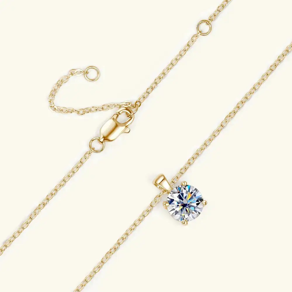 Gold necklace featuring a sparkling diamond pendant in a Moissanite Solitaire Drop design