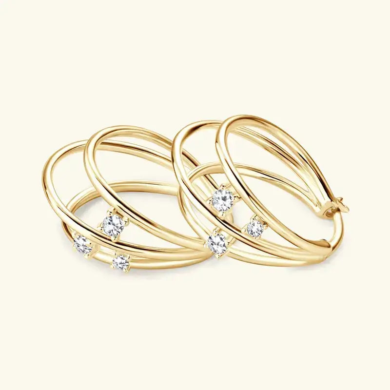 Gold rings with diamonds in an interlocking design of Original Split Three Hoop Earrings