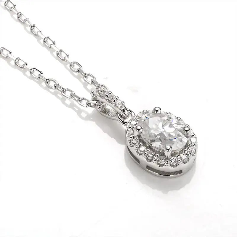 Oval Lab Grown Diamond Halo Pendant Necklace featuring a round center stone on silver chain