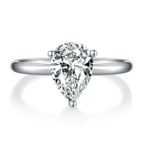 Pear cut moissanite diamond ring with silver band, elegant and timeless design