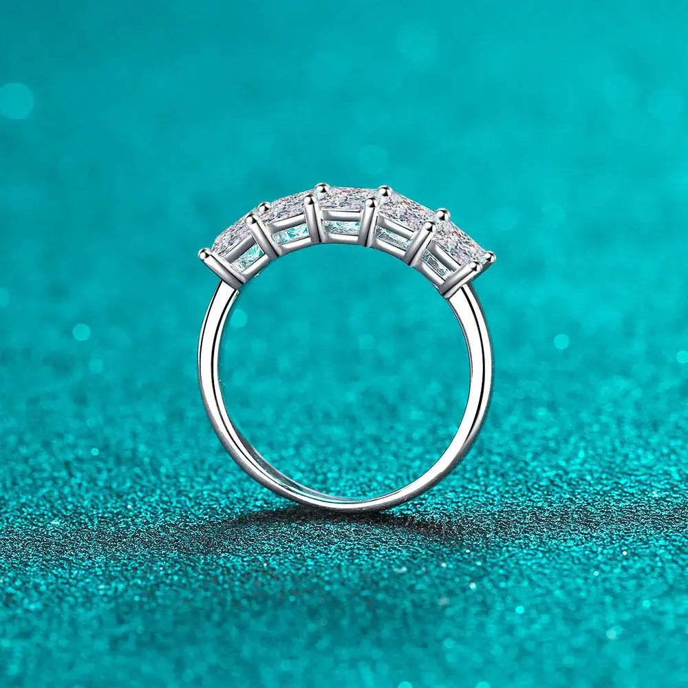 Silver ring featuring five square diamonds in an arc, Princess Cut Moissanite Wedding Band