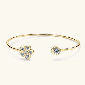 Gold bracelet featuring a flower-shaped cluster and a gem, showcasing lab grown diamond elegance