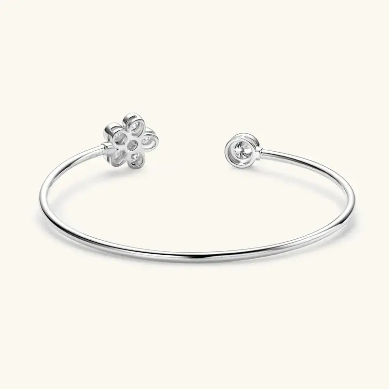 Silver open cuff bracelet featuring flower design and charm, exquisite lab grown diamond style