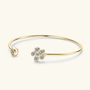 Gold diamond cuff bangle featuring a flower design and lab grown diamond accents