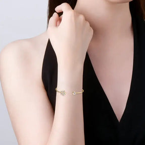 Delicate gold bracelet featuring a butterfly charm and crystal, part of the Lab Grown Diamond Cuff collection