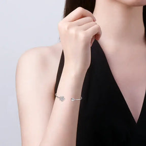 Delicate silver bracelet featuring a leaf charm from the Round D lab grown diamond cuff bangle