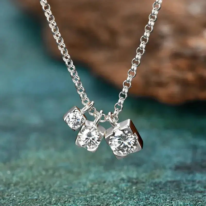 Silver necklace featuring three sparkling moissanite diamond pendants for timeless elegance