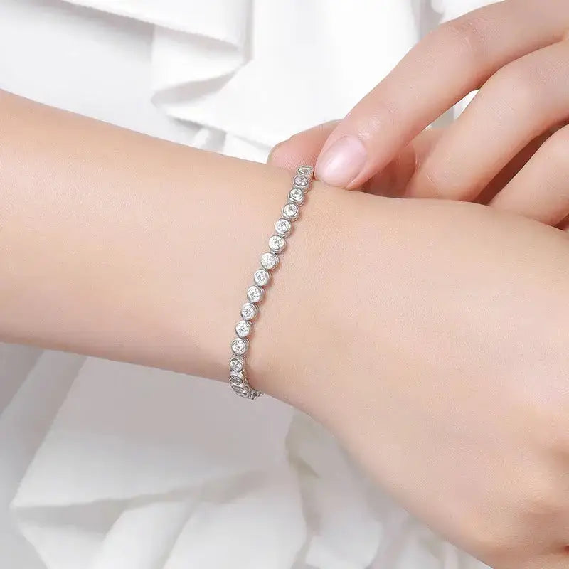 Delicate round Moissanite diamond tennis bracelet showcased elegantly on a wrist