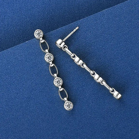 Asymmetrical silver dangle earrings featuring bezel 3mm lab grown diamonds and elegant crystals