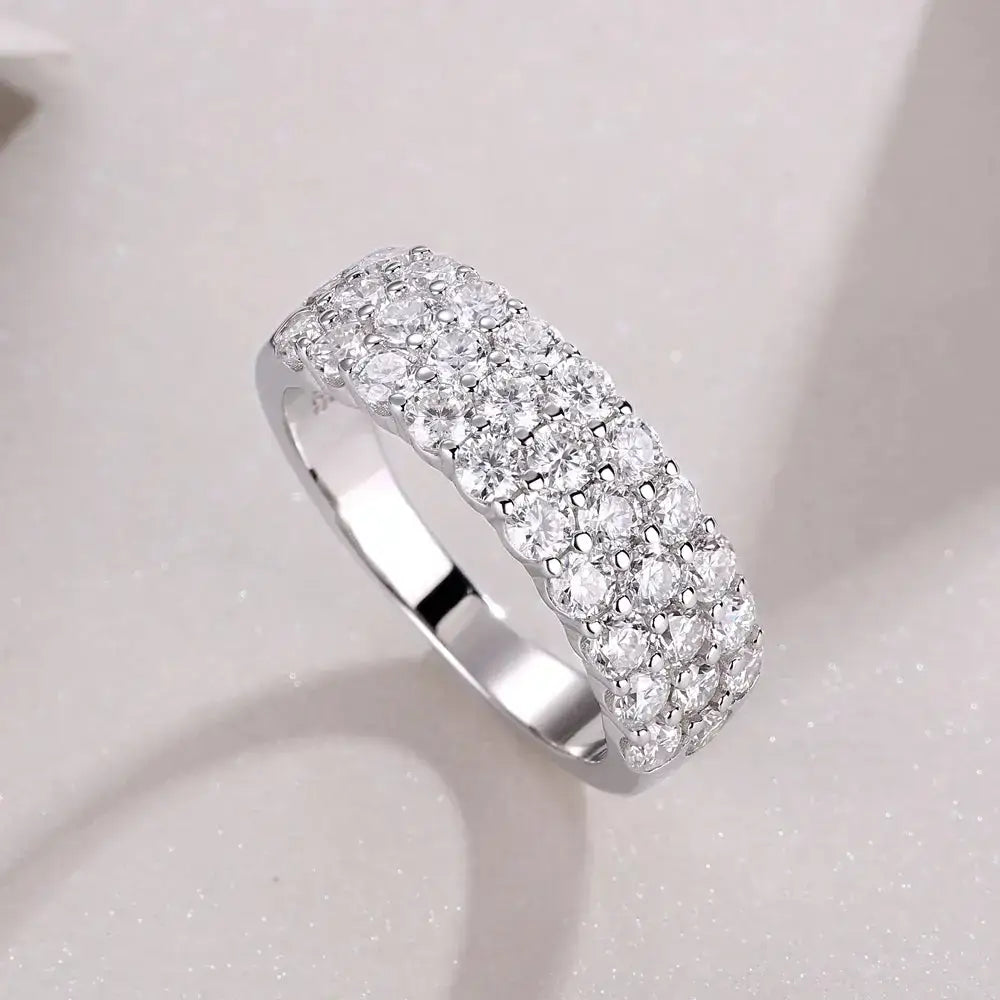 Diamond-encrusted silver band ring featuring sparkling GRA Moissanite in a sterling silver ring