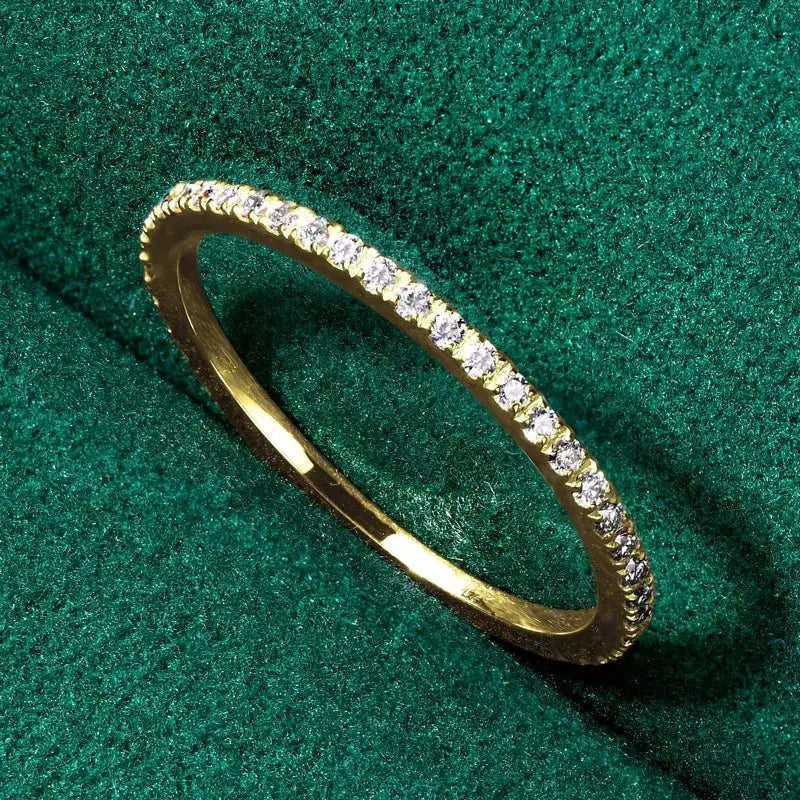 Gold Moissanite Wedding Band with small diamonds in pure yellow gold elegance