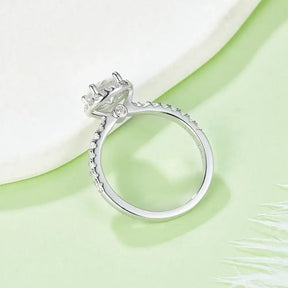 Diamond engagement ring featuring a solitaire moissanite diamond on a sterling silver classic band