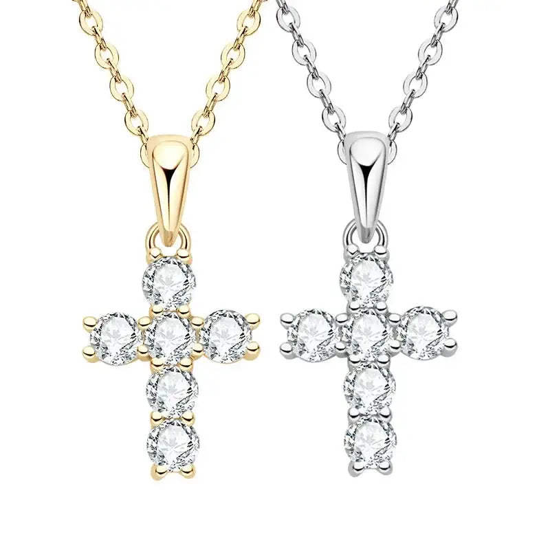 Two cross-shaped pendant necklaces in gold and sterling silver with 3mm moissanite