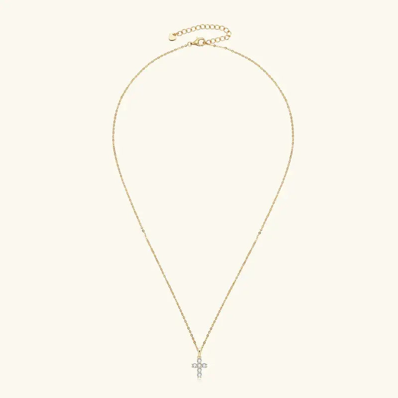 Gold chain necklace with a small cross pendant in sterling silver featuring 3mm moissanite