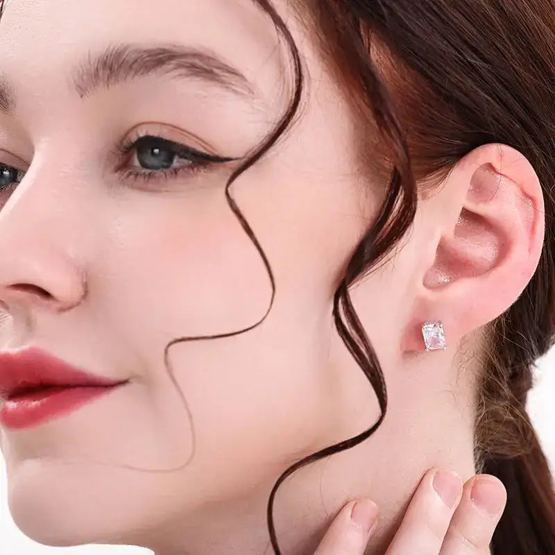 Close-up portrait of a woman highlighting a diamond stud earring and S925 Sterling Silver features