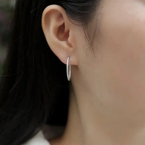 Silver hoop earrings featuring small diamonds in a sterling silver 20mm design