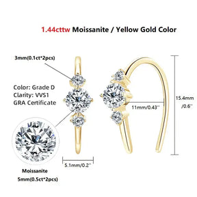 Yellow gold ring with three moissanite stones, complementing U Shaped Moissanite Earrings