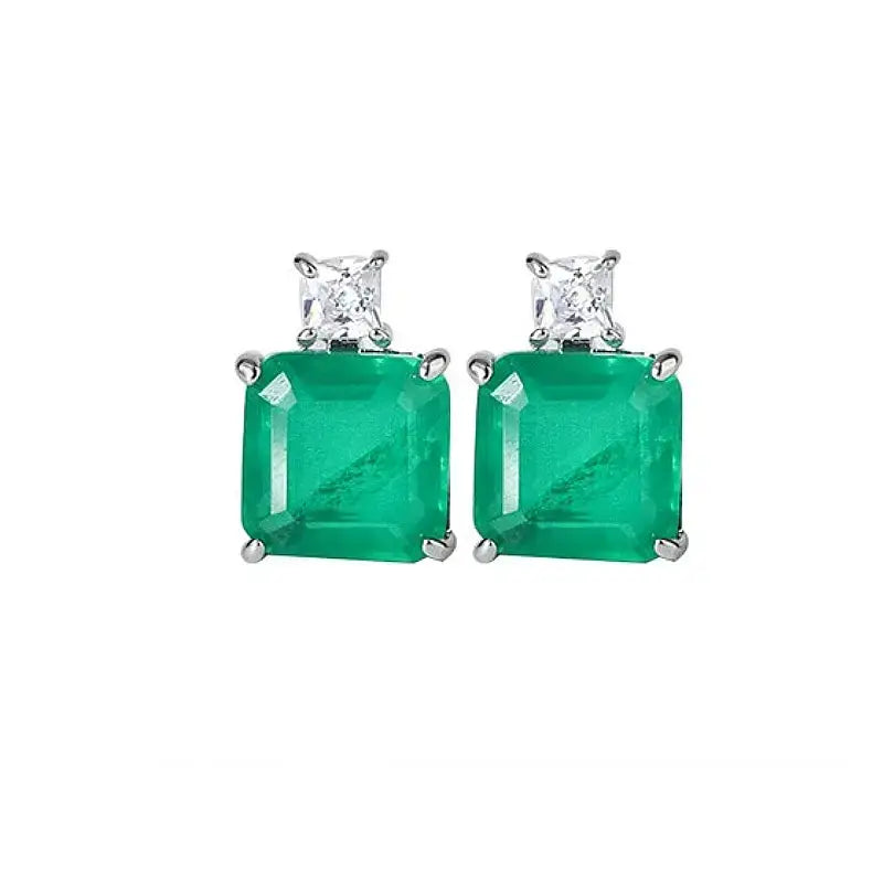 Vintage Sterling Silver Emerald Earrings feature stunning emerald and diamond studs